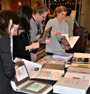 Professional early childhood educators scrutinize documentation of students' learning collected by Meredith Dodd as part of her work at University of Chicago Laboratory School